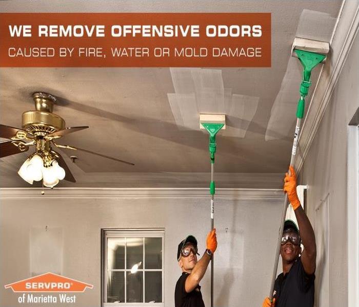 highly trained SERVPRO fire restoration specialist cleaning smoke & soot damage